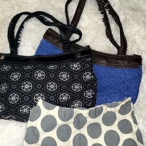 2 Thirty One skirt purses, one brown and one black with 3 purse skirts.